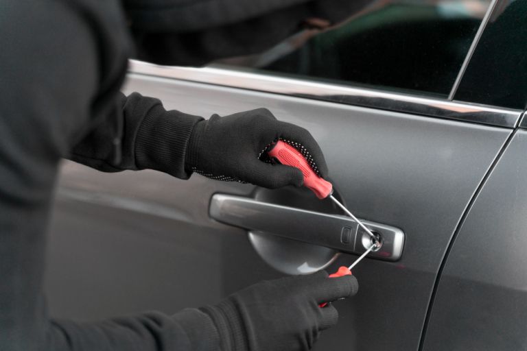 close-up-man-trying-break-into-car