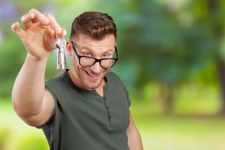 real-estate-agent-showing-new-house-key